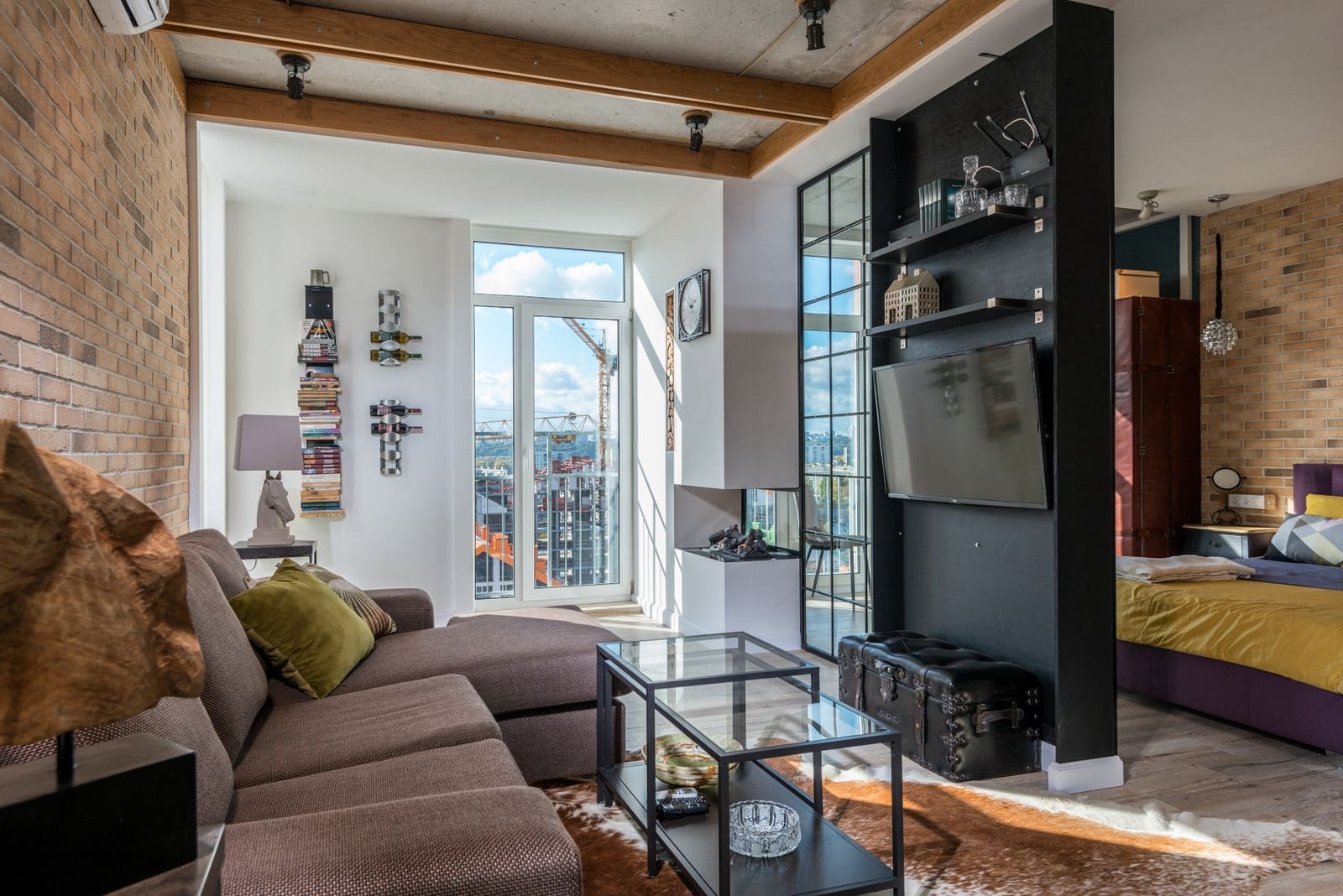 Bright loft apartment with a sofa, coffee table and contemporary decor