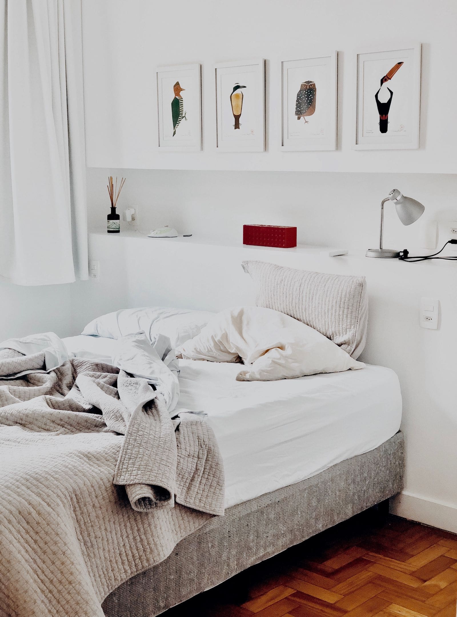 Softly lit bedroom with a neatly made bed
