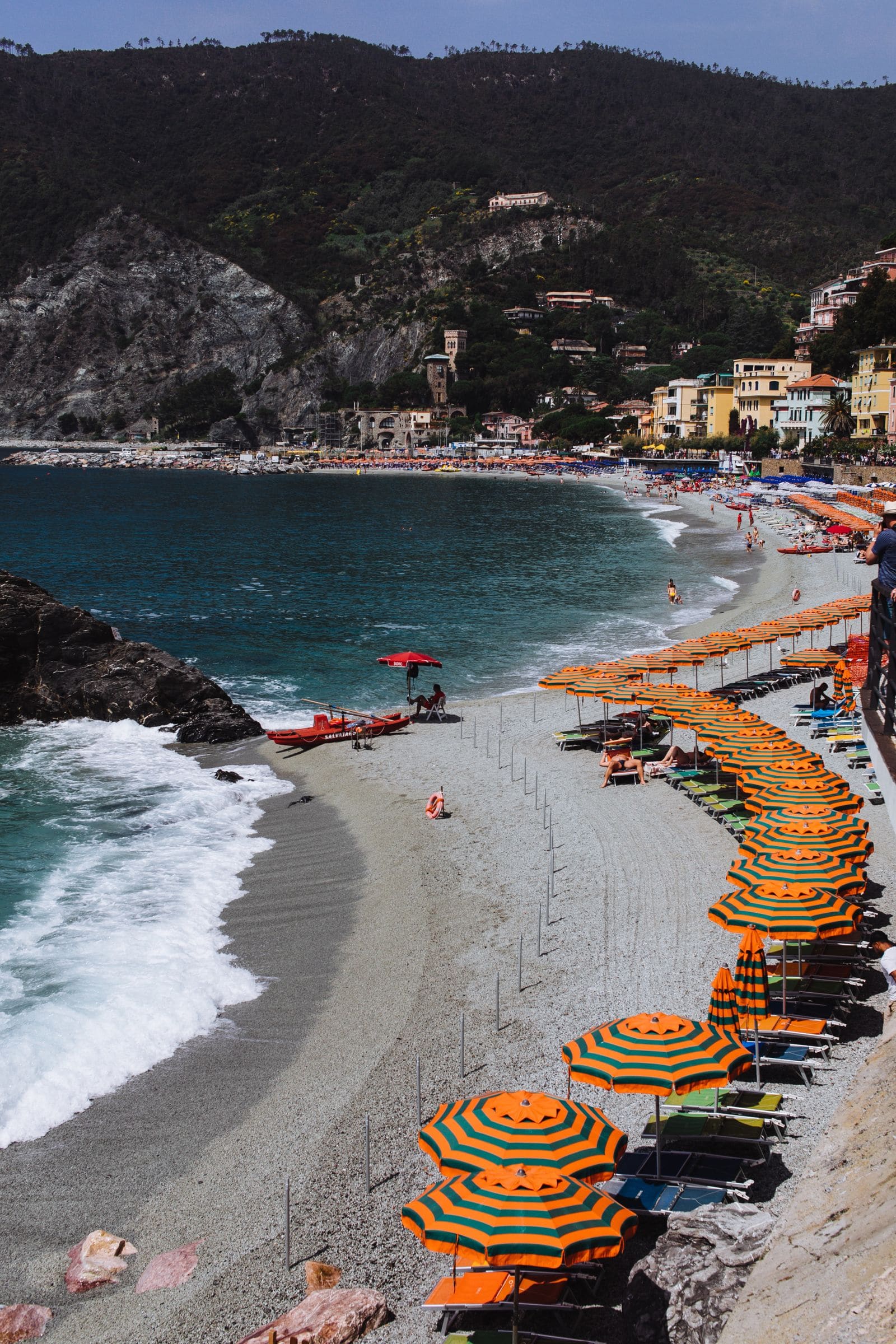 Sandy resort beach lined with sunbeds