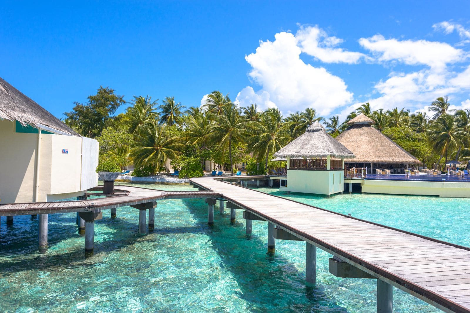 Beach resort with overwater bungalows and clear water
