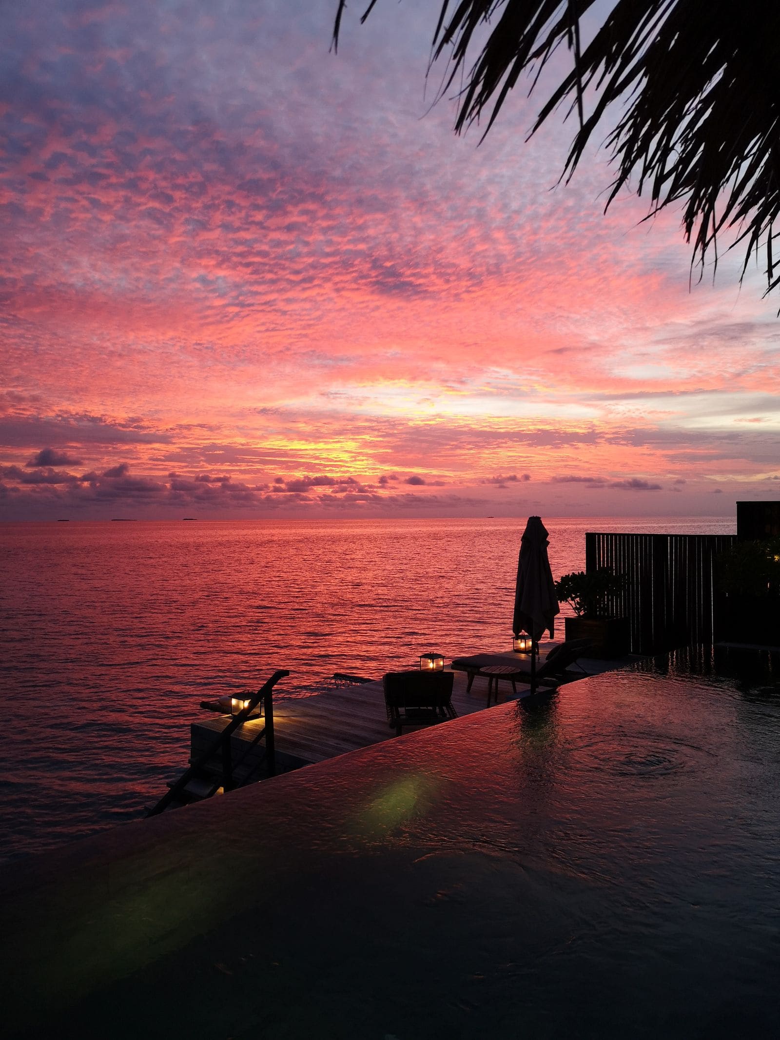 Infinity pool at a seaside resort at sunset