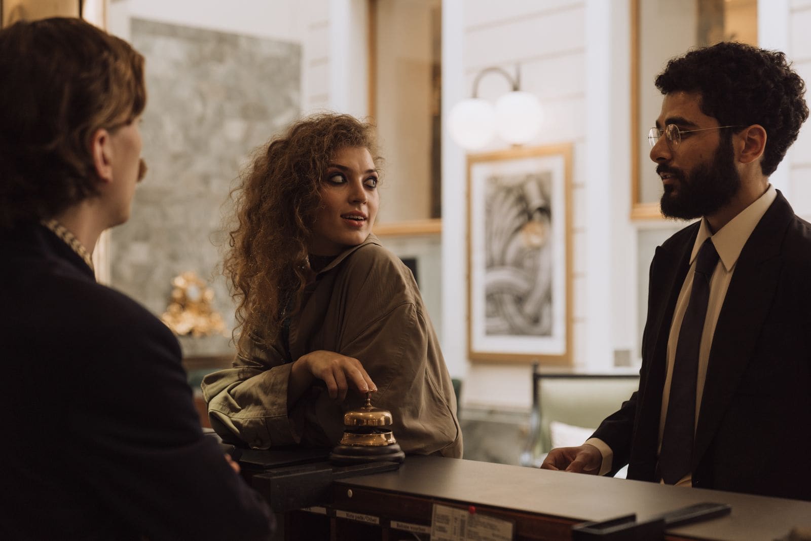 Guests checking in at a hotel front desk