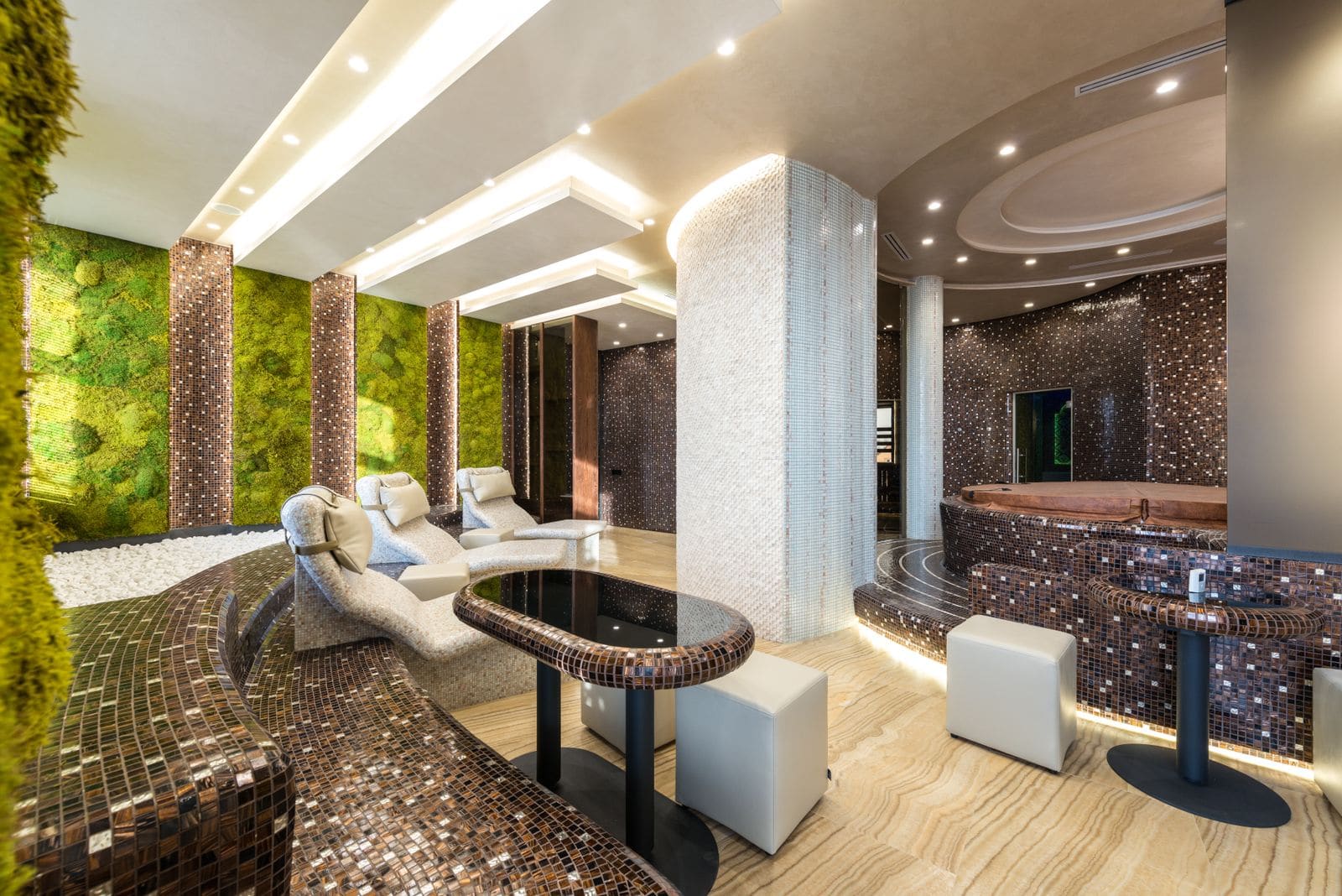 Modern luxury spa zone with loungers and bathtubs