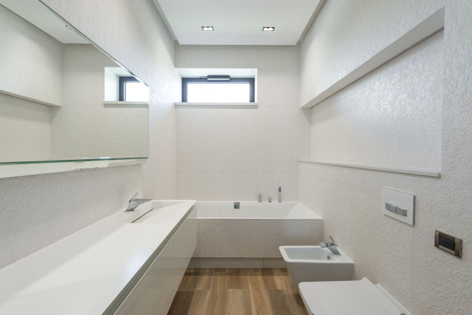 Modern bathroom with white walls and fitted furniture