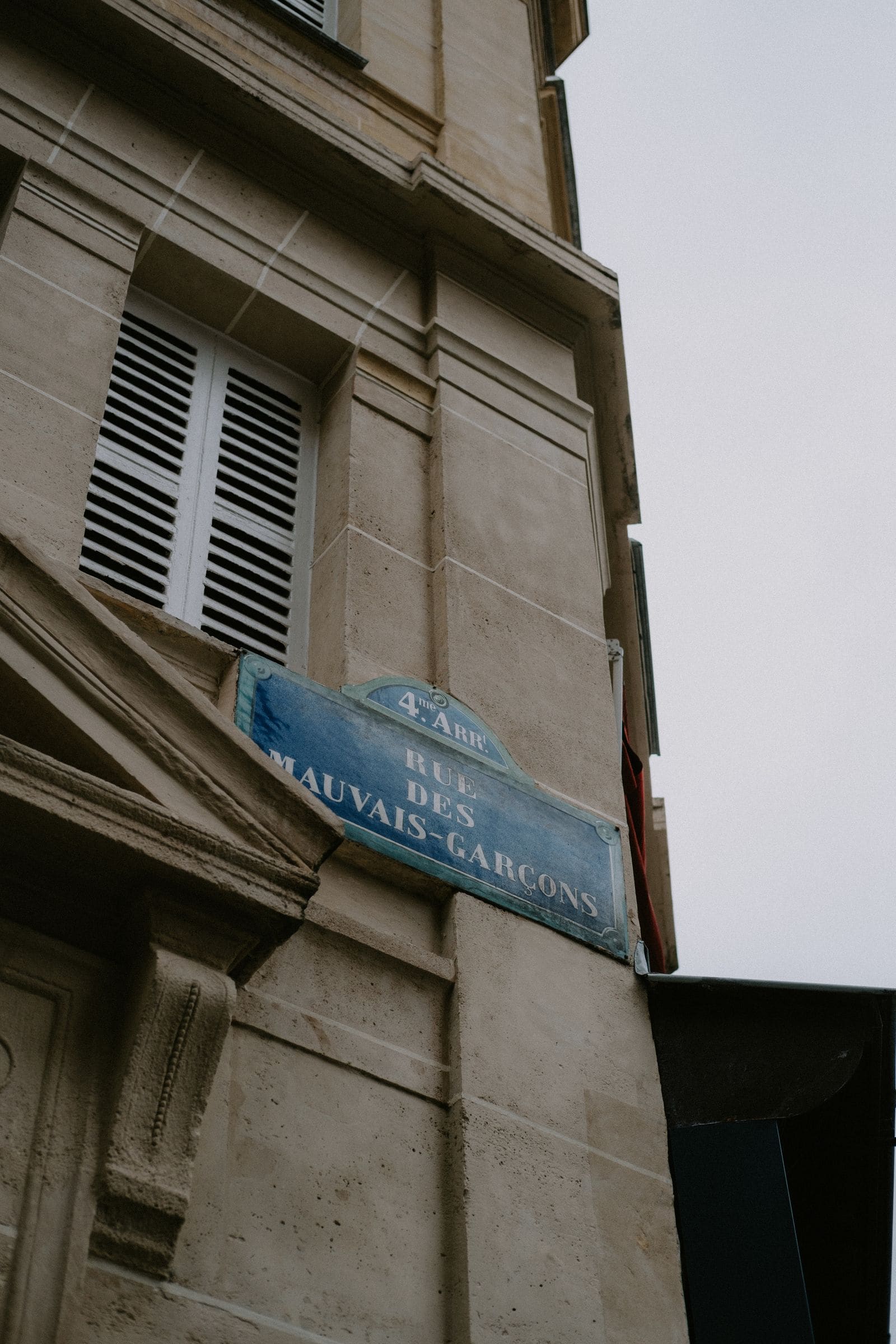 Classic city building exterior with a street sign