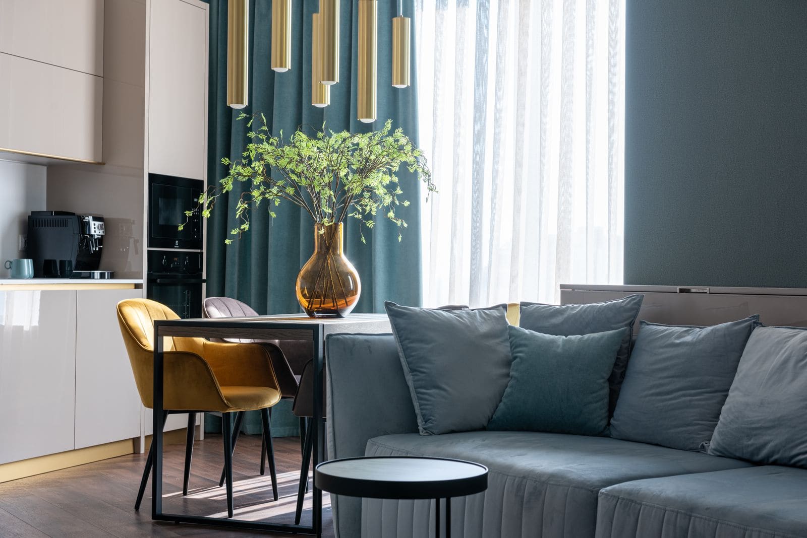 Studio apartment with a sofa and a kitchen zone