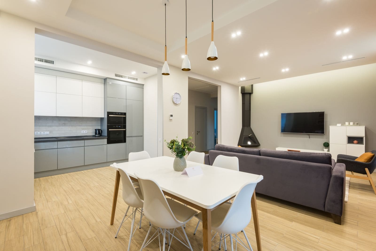 Stylish apartment with a couch alongside fitted kitchen furniture