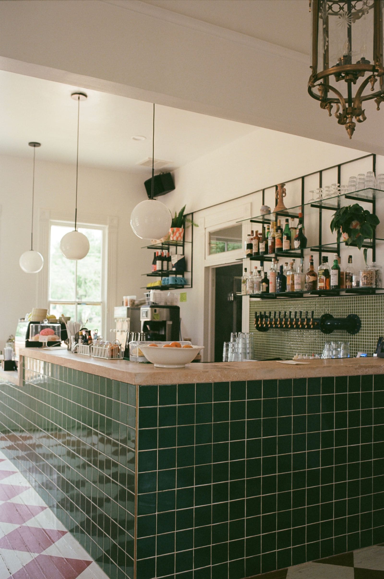 Bar counter of a restaurant with green tiles