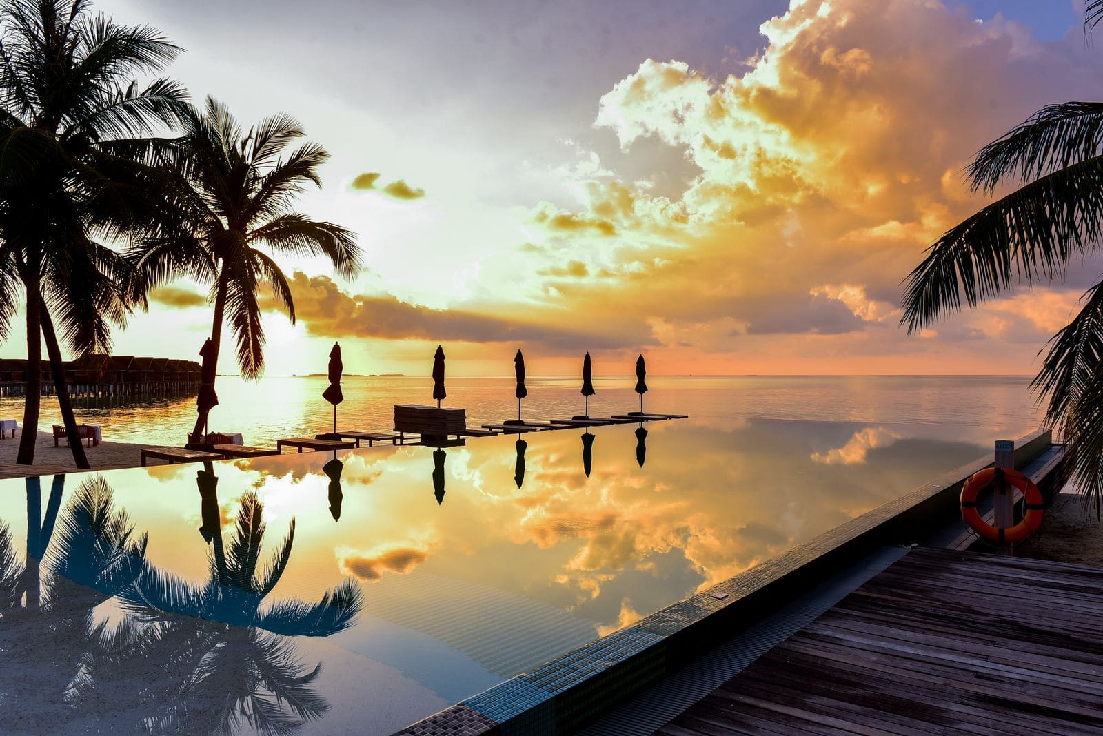Sunset over a tropical infinity pool