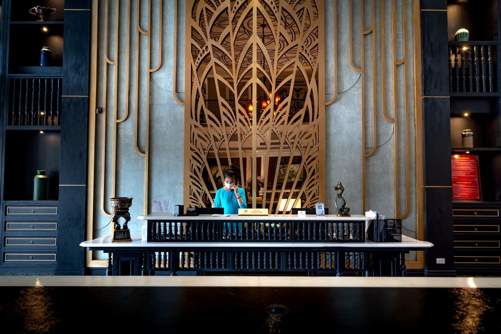 Receptionist at the desk of a luxurious hotel