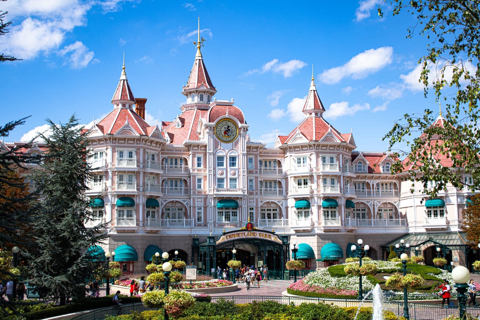 Ornate hotel facade and entrance canopy under a clear blue sky