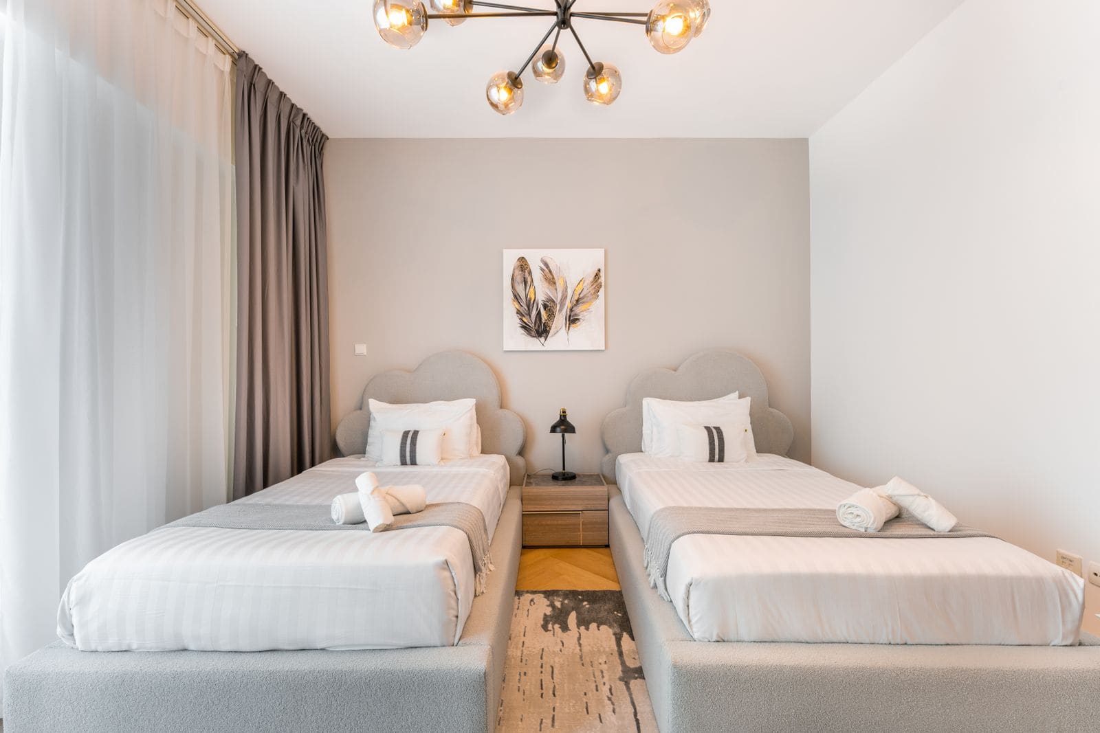 Two beds side by side in a hotel bedroom