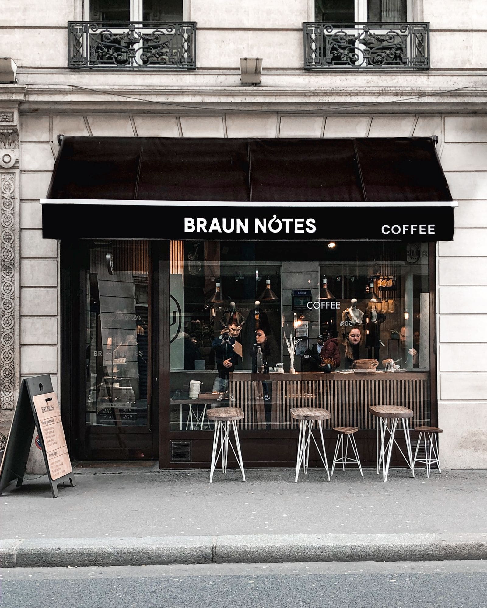 Stylish coffee shop with a glass wall and a street terrace