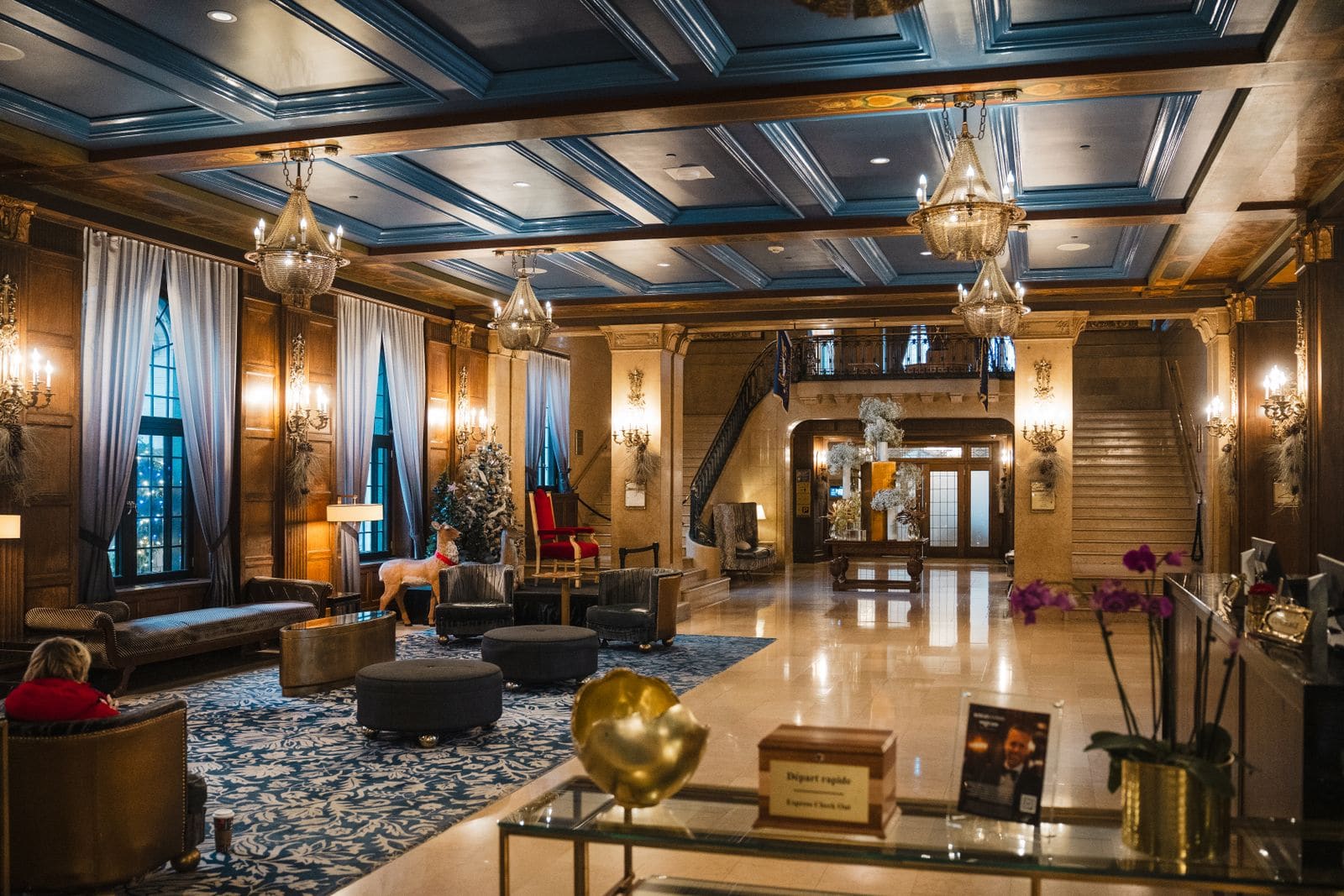 Elegant hotel lobby beneath a grand chandelier